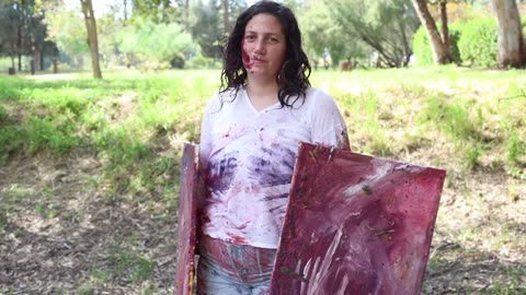 Merav after the forest session, paint on her hands and face
